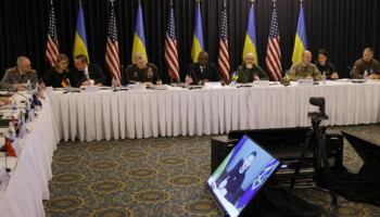 epa10417453 Ukrainian President Volodymyr Zelensky speaks on a video screen to participants of the third meeting of Ukraine Defense Contact Group at the US Air Base in Ramstein, Germany, 20 January 2023. The US Secretary of Defense Lloyd Austin has invited Ministers of Defense and senior military officials from around the world to Ramstein to discuss the ongoing crisis in Ukraine and various security issues facing US allies and partners.  EPA/RONALD WITTEK